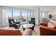 Bright living space features a balcony, comfortable seating, and serene water views at 500 Treasure Island Cswy # 308, Treasure Island, FL 33706