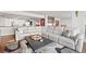 Spacious living area featuring a large sectional sofa, area rug, and an open view of the kitchen at 500 Treasure Island Cswy # 308, Treasure Island, FL 33706