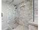 A glass shower showcasing elegant tile work and modern shower fixtures at 500 Treasure Island Cswy # 308, Treasure Island, FL 33706