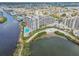 Breathtaking aerial view of a waterfront condo community with a sparkling pool, beach and lush landscaping at 5915 Sea Ranch Dr # 703, Hudson, FL 34667