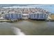 Scenic aerial view of the condo building, beach and waterfront neighborhood at 5915 Sea Ranch Dr # 703, Hudson, FL 34667