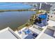 Scenic aerial view of the condo building with waterfront views and a community pool at 5915 Sea Ranch Dr # 703, Hudson, FL 34667
