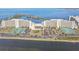 Aerial view of building, tennis courts, parking, and water views at 5915 Sea Ranch Dr # 703, Hudson, FL 34667