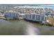 Scenic aerial view of the condo building near the beach and waterfront community at 5915 Sea Ranch Dr # 703, Hudson, FL 34667