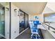 A cozy balcony features comfortable seating and an art installation at 5915 Sea Ranch Dr # 703, Hudson, FL 34667
