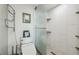 Clean bathroom featuring a glass-enclosed shower with built-in shelves at 5915 Sea Ranch Dr # 703, Hudson, FL 34667