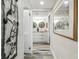 A hallway leads into a pristine and modern bathroom at 5915 Sea Ranch Dr # 703, Hudson, FL 34667