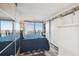 Inviting bedroom with sliding doors and large windows offering a glimpse of the ocean at 5915 Sea Ranch Dr # 703, Hudson, FL 34667