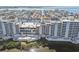 Waterfront condo building with balconies overlooks the water and surrounding neighborhood at 5915 Sea Ranch Dr # 703, Hudson, FL 34667