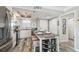 Open kitchen with dining island, stainless appliances, and white cabinets at 5915 Sea Ranch Dr # 703, Hudson, FL 34667