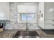 Close-up of a modern kitchen sink with marble backsplash and stainless steel faucet at 5915 Sea Ranch Dr # 703, Hudson, FL 34667