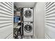 Convenient laundry closet with stacked washer and dryer units, maximizing space at 5915 Sea Ranch Dr # 703, Hudson, FL 34667
