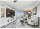 This living room has lots of light, coastal themed decor, and a large entertainment center at 5915 Sea Ranch Dr # 703, Hudson, FL 34667