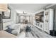 Large entertainment center and open floor plan to kitchen make this living room a great gathering space at 5915 Sea Ranch Dr # 703, Hudson, FL 34667
