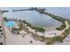 Aerial view of the community pool, sun deck, beach area and bay at 5915 Sea Ranch Dr # 703, Hudson, FL 34667