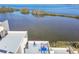 View of building roof deck with multiple seating areas overlooking the waterfront at 5915 Sea Ranch Dr # 703, Hudson, FL 34667
