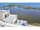 View of building roof deck with multiple seating areas overlooking the waterfront at 5915 Sea Ranch Dr # 703, Hudson, FL 34667
