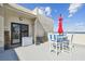 This roof top patio has an outdoor dining set perfect for enjoying a meal with a beautiful view at 5915 Sea Ranch Dr # 703, Hudson, FL 34667