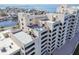 An aerial view of a condo building with a rooftop patio perfect for entertaining guests at 5915 Sea Ranch Dr # 703, Hudson, FL 34667