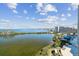 A beautiful water view on a clear sunny day with buildings and a pool visible at 5915 Sea Ranch Dr # 703, Hudson, FL 34667