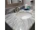 Close-up of bathroom sink with modern faucet and elegant marble countertop at 6421 Banyan Blvd # 302, New Port Richey, FL 34652