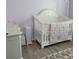 Cozy Bedroom with a white crib, changing table, and accent rug at 6421 Banyan Blvd # 302, New Port Richey, FL 34652