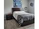 Cozy bedroom with a large bed, soft bedding, and a wooden headboard at 6421 Banyan Blvd # 302, New Port Richey, FL 34652