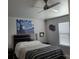 Comfortable bedroom features a bed, ceiling fan, and bright natural light at 6421 Banyan Blvd # 302, New Port Richey, FL 34652
