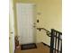 Front door with a 'HOME' doormat and unit number on the exterior wall at 6421 Banyan Blvd # 302, New Port Richey, FL 34652