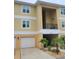 Charming two-story condo with a one-car garage, quaint landscaping, and covered balcony at 6421 Banyan Blvd # 302, New Port Richey, FL 34652