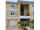Charming two-story condo with a one-car garage, quaint landscaping, and covered balcony at 6421 Banyan Blvd # 302, New Port Richey, FL 34652