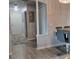 Hallway leads to a dining area with bar-height table and chairs at 6421 Banyan Blvd # 302, New Port Richey, FL 34652