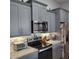 Beautiful eat-in kitchen featuring stainless steel appliances and a subway tile backsplash at 6421 Banyan Blvd # 302, New Port Richey, FL 34652