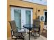 Cozy outdoor patio seating area with comfortable chairs and a small glass table at 6421 Banyan Blvd # 302, New Port Richey, FL 34652