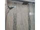 Elegant tiled shower featuring dual shower heads and decorative mosaic accents at 6421 Banyan Blvd # 302, New Port Richey, FL 34652