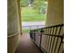 Stairwell showing stairs leading to the green space and street below at 6421 Banyan Blvd # 302, New Port Richey, FL 34652