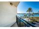 Balcony featuring a view of the swimming pool and waterway at 690 Island Way # 404, Clearwater Beach, FL 33767