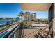 Balcony with outdoor seating and views of the waterfront, swimming pool, and community at 690 Island Way # 404, Clearwater Beach, FL 33767