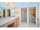 Well-lit bathroom featuring a long vanity with cabinets and drawers, and a separate toilet and shower area at 690 Island Way # 404, Clearwater Beach, FL 33767
