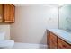 Well-maintained bathroom featuring a vanity with storage and a toilet at 690 Island Way # 404, Clearwater Beach, FL 33767