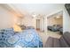 Spacious bedroom features twin beds, ceiling fan, and mirrored closet doors at 690 Island Way # 404, Clearwater Beach, FL 33767