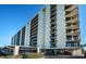Exterior of a modern condo building with private balconies and convenient covered parking at 690 Island Way # 404, Clearwater Beach, FL 33767