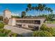 Island Estates sign, a waterfront residential and shopping community, with lush landscaping at 690 Island Way # 404, Clearwater Beach, FL 33767