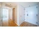 Bright hallway with light wood flooring, white doors, and neutral wall paint at 690 Island Way # 404, Clearwater Beach, FL 33767