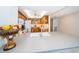 Modern kitchen with bar seating, white countertops and an open view into the living room at 690 Island Way # 404, Clearwater Beach, FL 33767