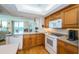 Kitchen with breakfast bar overlooking the dining and living areas and a beautiful waterfront view at 690 Island Way # 404, Clearwater Beach, FL 33767