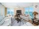 Living room with water view, neutral paint, ceiling fan and comfortable furnishings at 690 Island Way # 404, Clearwater Beach, FL 33767