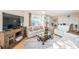 Comfortable living room featuring bright neutral paint, modern furnishings, and water views at 690 Island Way # 404, Clearwater Beach, FL 33767