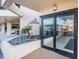 Welcoming lobby entrance with automatic doors, landscaping, and access to parking at 690 Island Way # 404, Clearwater Beach, FL 33767