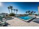 Community pool and spa surrounded by lush landscaping and waterfront views at 690 Island Way # 404, Clearwater Beach, FL 33767